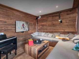 Experience the warmth of this stunning living space, featuring exquisite wood paneling and a cozy, inviting atmosphere.