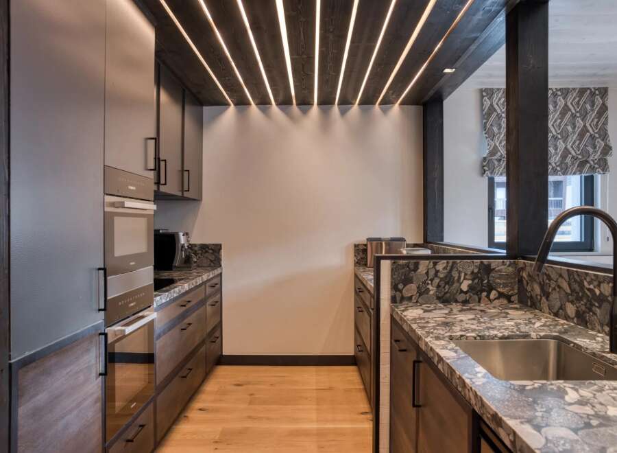 Experience luxury living in this stunning kitchen! Featuring sleek cabinetry, modern appliances, and a beautiful countertop, this space is perfect for both cooking and entertaining.