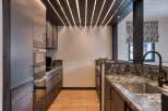 Experience luxury living in this stunning kitchen! Featuring sleek cabinetry, modern appliances, and a beautiful countertop, this space is perfect for both cooking and entertaining.