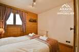 Discover the charm of this cozy bedroom featuring two comfortable beds, perfect for a relaxing stay.