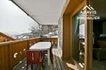 Enjoy breathtaking mountain views from this charming balcony.