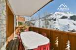 Enjoy breathtaking mountain views from this charming balcony.