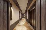 Step into luxury with this stunning hotel hallway.