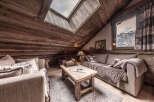 Step into a cozy mountain retreat with this stunning living space.