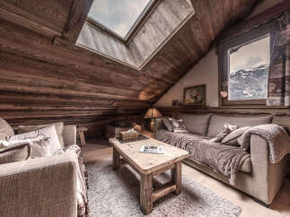 Step into a cozy mountain retreat with this stunning living space.