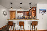 This stunning kitchen boasts a modern design with sleek stainless steel appliances and beautiful wooden cabinetry.