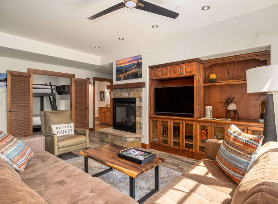 This stunning living space boasts a cozy fireplace, perfect for chilly evenings.