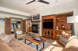 This stunning living space boasts a cozy fireplace, perfect for chilly evenings.