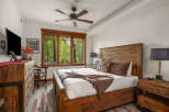 This stunning bedroom boasts a rustic charm with its wooden furniture and inviting ambiance.