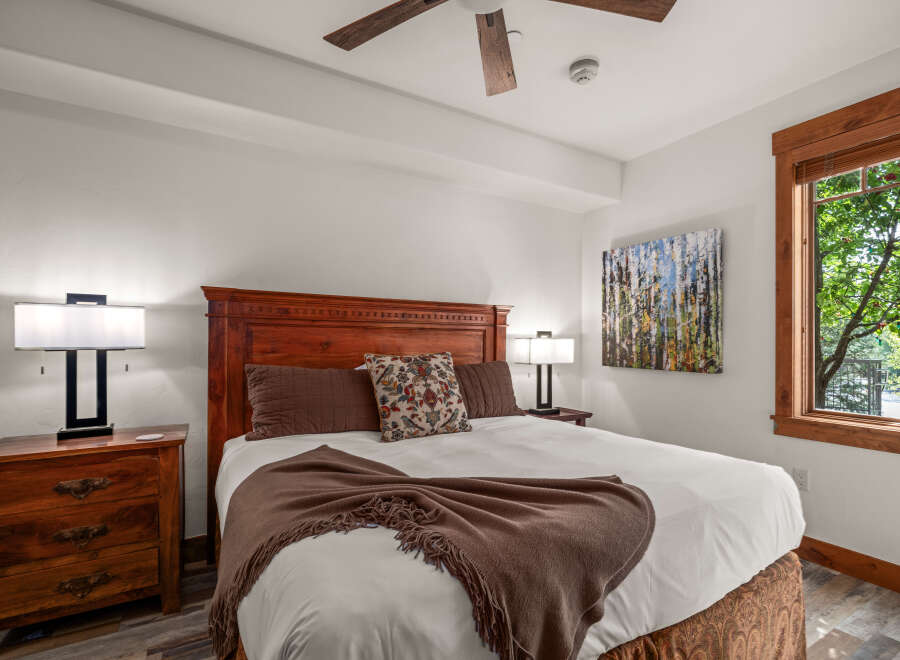 This inviting bedroom boasts a warm and inviting ambiance, perfect for relaxation.