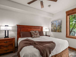 This inviting bedroom boasts a warm and inviting ambiance, perfect for relaxation.