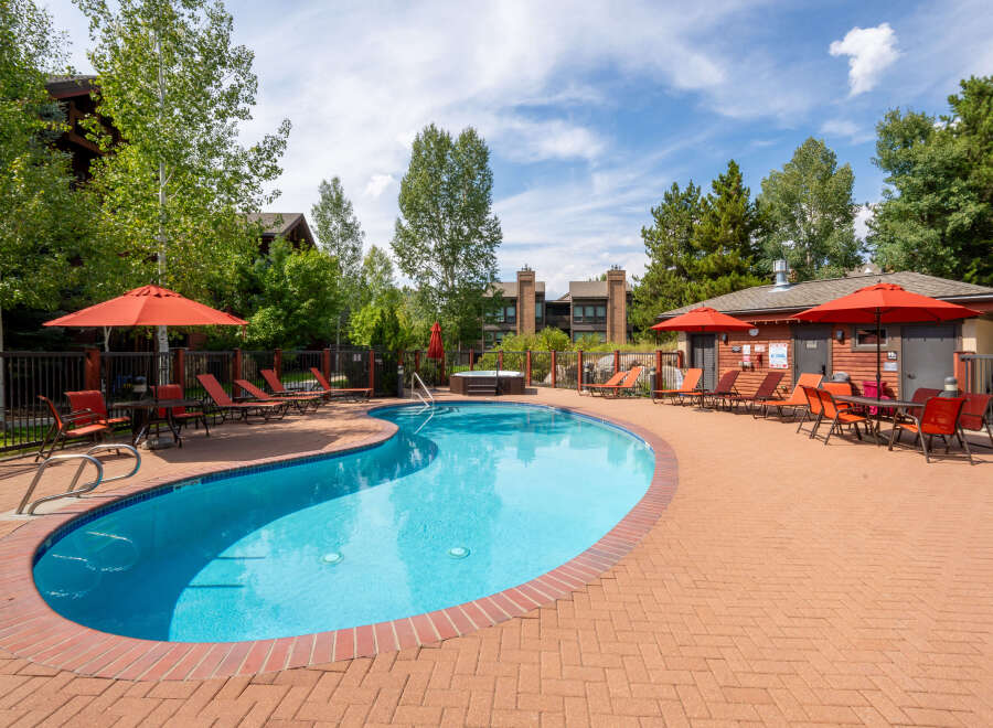 Enjoy a relaxing day at this beautiful outdoor pool, perfect for unwinding and soaking up the sun.