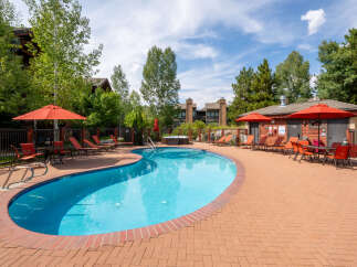Enjoy a relaxing day at this beautiful outdoor pool, perfect for unwinding and soaking up the sun.