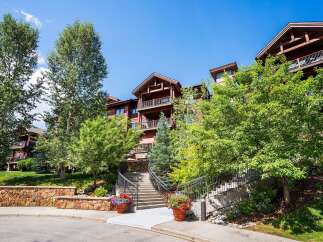 Discover luxury living in this stunning property! This home features a beautiful exterior with a charming staircase leading to the entrance.