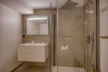 Step into a modern bathroom oasis, featuring sleek design and high-end finishes.