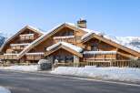 Discover the charm of this stunning chalet nestled in a winter wonderland.