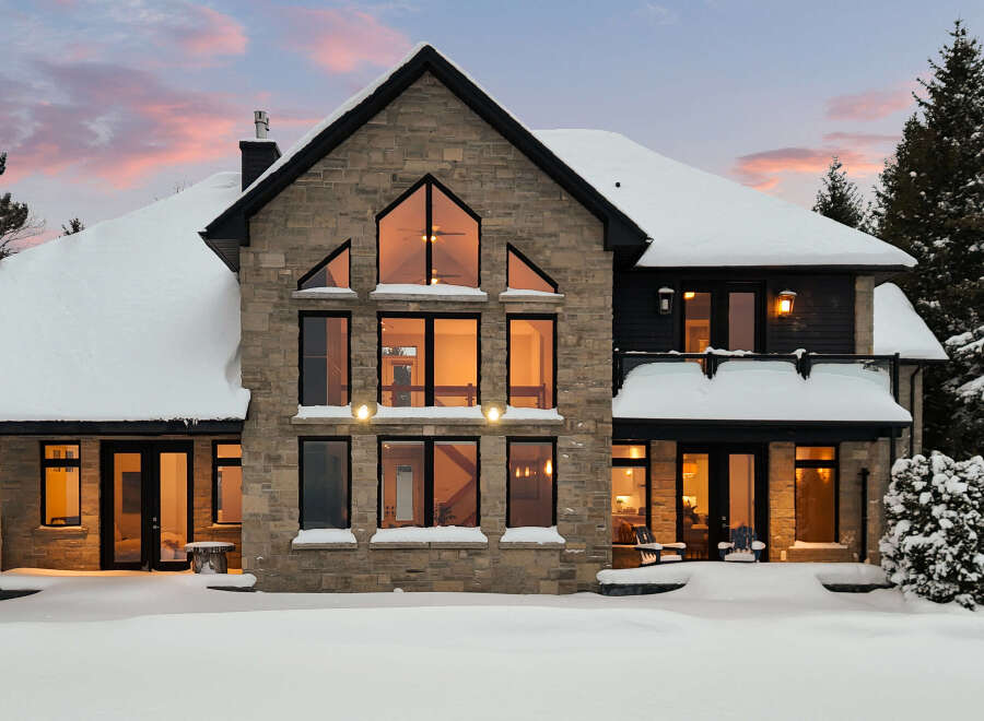 This stunning stone-clad home offers a luxurious winter escape.