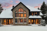 This stunning stone-clad home offers a luxurious winter escape.