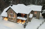This stunning property showcases a modern architectural design, perfect for those seeking a luxurious winter retreat.