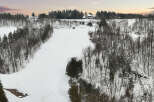 This stunning property offers a serene winter landscape, perfect for those seeking a peaceful retreat.
