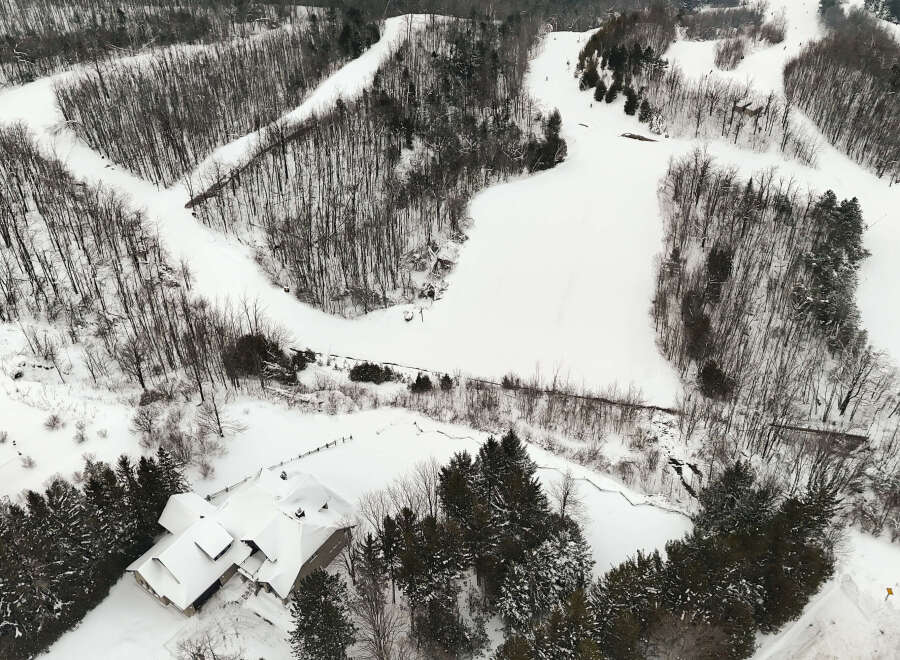 Nestled in a winter wonderland, this property offers a unique blend of natural beauty and recreational opportunities.