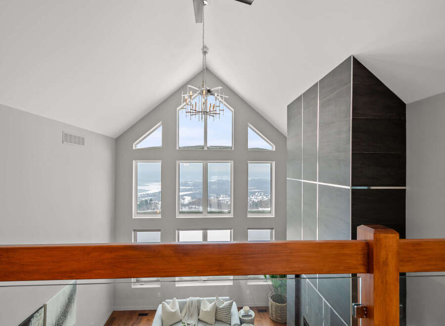 Experience luxury living in this stunning property featuring soaring ceilings and expansive windows that flood the space with natural light.