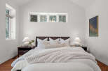 This stunning bedroom boasts a modern design with a cozy atmosphere.