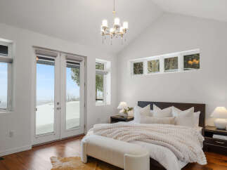 Experience luxury in this stunning bedroom featuring a modern design and ample natural light.