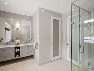 Step into luxury with this stunning bathroom, featuring a sleek, modern design.