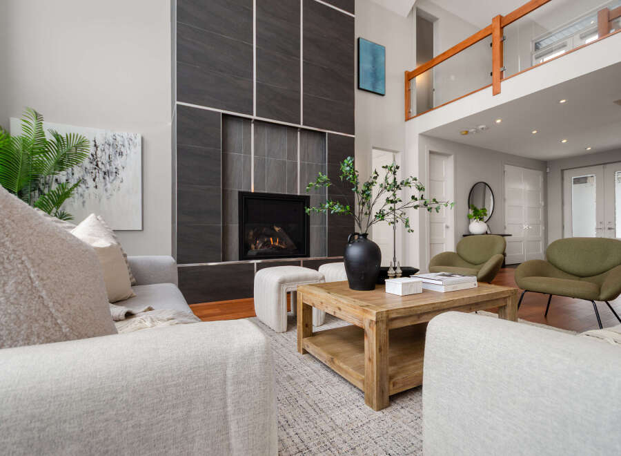 Step into luxury with this stunning living room, featuring a modern fireplace and stylish seating.