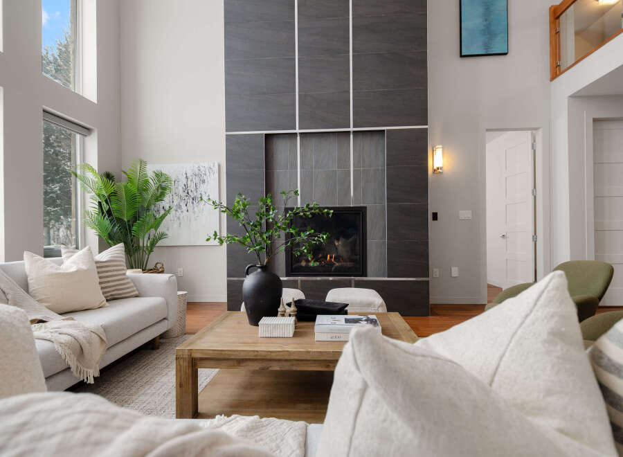 Step into luxury with this stunning living room, featuring a modern fireplace and elegant design.