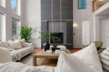 Step into luxury with this stunning living room, featuring a modern fireplace and elegant design.
