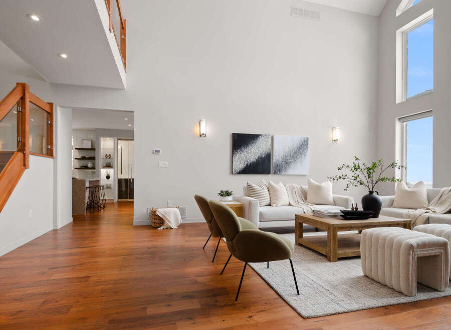 Step into luxury with this stunning living space, boasting soaring ceilings and an abundance of natural light.