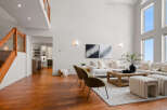 Step into luxury with this stunning living space, boasting soaring ceilings and an abundance of natural light.