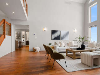 Step into luxury with this stunning living space, boasting soaring ceilings and an abundance of natural light.