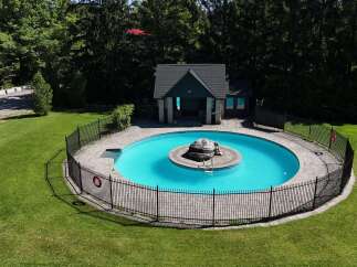 Escape to this stunning property featuring a beautifully designed in-ground pool, perfect for relaxation and entertainment.