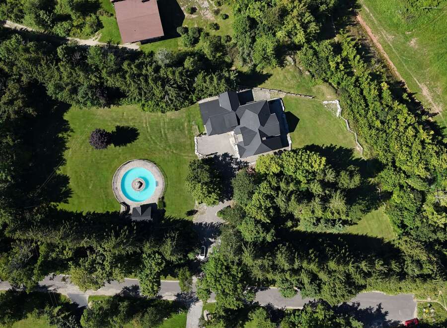 Discover this stunning property featuring a unique circular pool with a fountain, perfect for relaxation and entertainment.