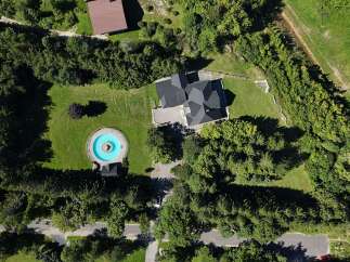 Discover this stunning property featuring a unique circular pool with a fountain, perfect for relaxation and entertainment.