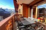 Enjoy breathtaking mountain views from this charming balcony.