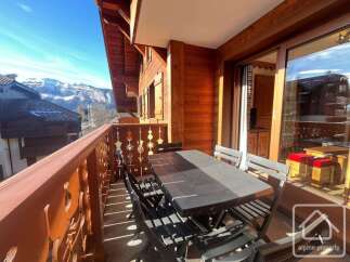 Enjoy breathtaking mountain views from this charming balcony.