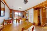 Discover the charm of this cozy property, featuring a warm wooden interior and a bright, inviting living space.
