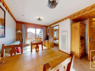 Discover the charm of this cozy property, featuring a warm wooden interior and a bright, inviting living space.