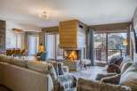 Experience the epitome of luxury in this stunning property, featuring a cozy living room with a fireplace, perfect for those chilly evenings.