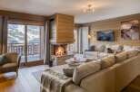 Experience the ultimate in luxury living with this stunning property featuring a cozy fireplace and breathtaking mountain views.