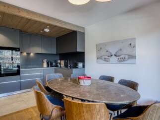 This stunning property boasts a modern kitchen with sleek cabinetry and top-of-the-line appliances, perfect for culinary enthusiasts.