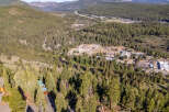 This stunning property offers breathtaking views of the surrounding mountains and lush forests.