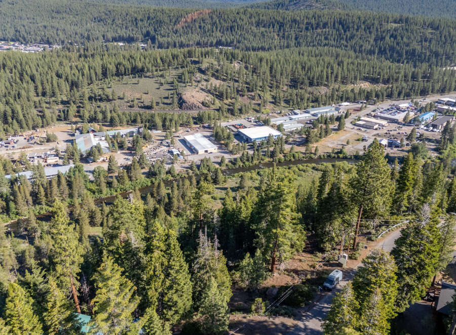 Discover a stunning property nestled in a serene, forested landscape.