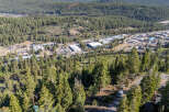Discover a stunning property nestled in a serene, forested landscape.
