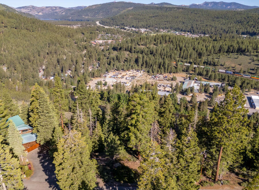 Nestled amidst a lush forest, this property offers a serene escape with stunning natural views.