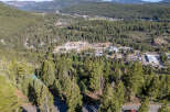 Nestled amidst a lush, green forest, this property offers a serene escape with stunning natural views.
